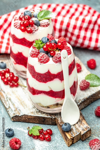 Scottish dessert whipped cream, roasted oatmeal and raspberries in jar. banner, menu, recipe place for text, top view