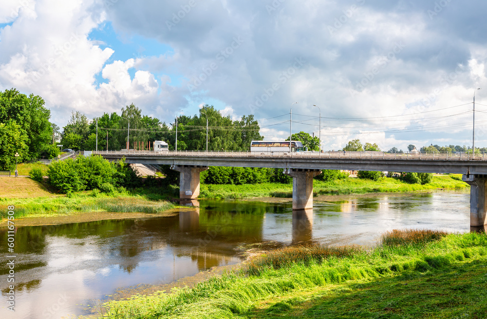 Stone city bridge across the Tvertsa river in summer sunny day