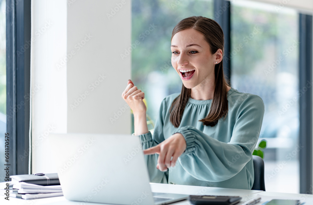 Excited business woman surprise looking on laptop having a good news.. Excited business woman surprise looking on laptop having a good news..