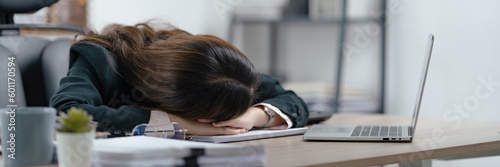 Fotografie Young asian woman secretary sleepy at work..