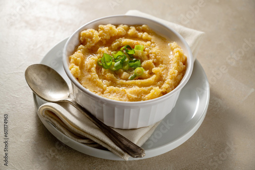 Root mash. Root vegetables mashed in a bowl. Garnished with oil and herbs.