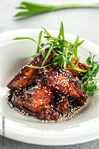barbecue chicken wings. vertical image. top view. place for text