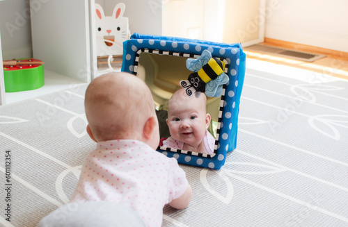 Baby looking in the mirror during tummy time