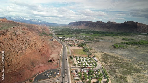 High wide aerial view of highway 191 and red sandstone canyon walls through Moab Utah in spring time photo