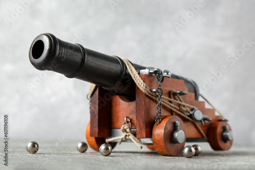 Fotografering Toy model of cannon on grey background