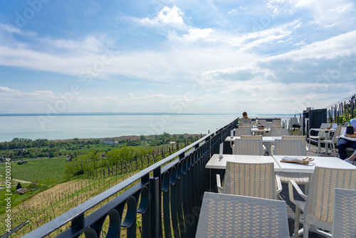 table and chairs with a beautiful view next to lake Balaton in Badacsony Hungary © Bernadett