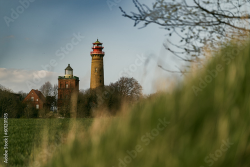 Germany - Rugen - Lighthouses and navigation tower - Cape Arkona - Blue sky grass two buildings