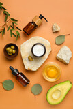 Composition with natural cosmetics, ingredients and stones on color background