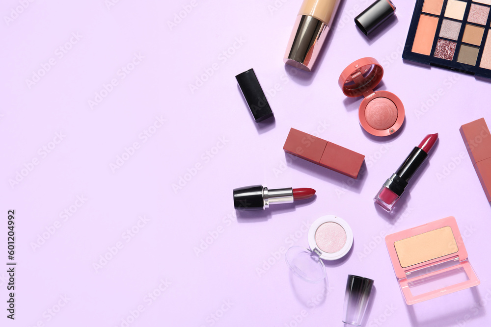 Decorative cosmetics with lipsticks on lilac background Decorative cosmetics with lipsticks on lilac background