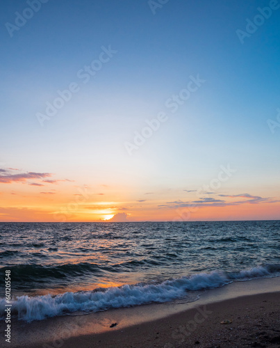 Vertical front viewpoint landscape travel summer sea wind wave cool on holiday calm coastal big sun set sky light orange golden Nature tropical Beautiful evening hour day At Bang san Beach Thailand. © Singh