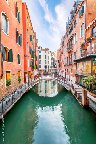 Fabulous cityscape of Venice with narrow canals, boats and gondolas and bridges with traditional buildings © pilat666