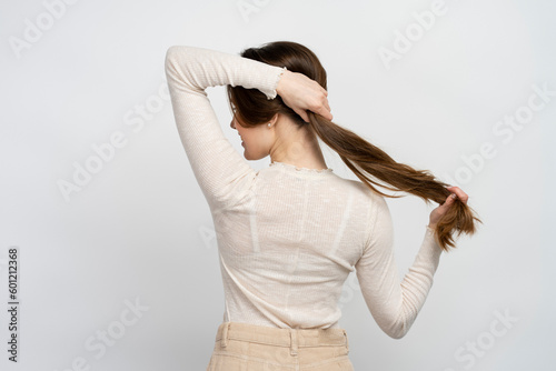 Young woman with long hair isolated on white background