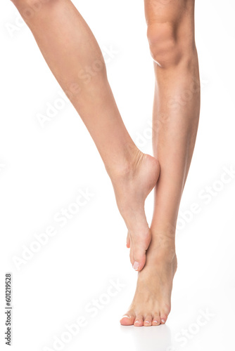 Slim female legs on isolated white background. © forma82