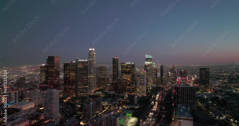 Scenic aerial view of skyscrapers in Los Angeles city at night. Illuminated buildings in Los Angeles skyline, Aerial drone shot, Los Angeles, California. Skyline towers in LA. Scenic aerial view of skyscrapers in Los Angeles city at night. Illuminated buildings in Los Angeles skyline, Aerial drone shot, Los Angeles, California. Skyline towers in LA.