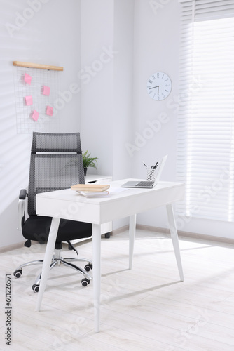 Desk and comfortable chair in modern office. Interior design © New Africa