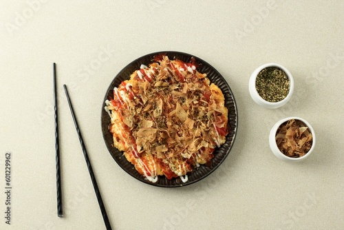 Фотография Okonomiyaki, Japanese Osaka Seafood Pancake with Dried Bonito