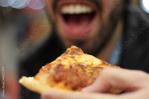 person eating pizza