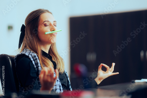 Office Woman Balancing a Pen Under her Nose in Breathing Exercise. Businesswoman trying to relax in need to unwind from work
 photo