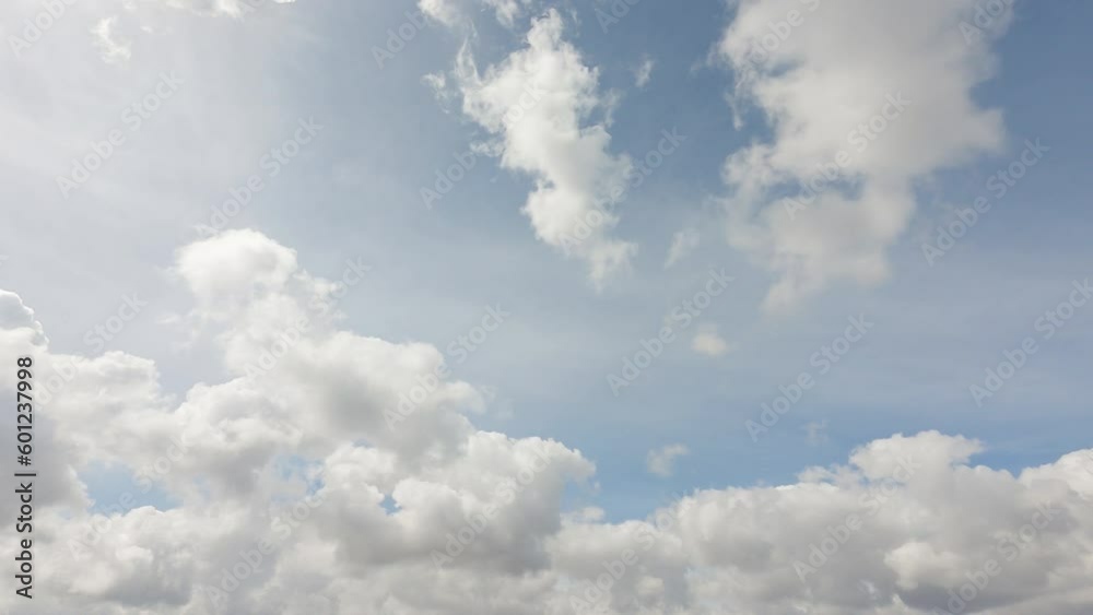 beautiful smoothie cumulus clouds in soft blue sky summer season. dreamy cloud covered bright sun in clear good atmosphere day, cloudscape timelapse of power sun beams, rays in midday heavenly sky beautiful smoothie cumulus clouds in soft blue sky summer season. dreamy cloud covered bright sun in clear good atmosphere day, cloudscape timelapse of power sun beams, rays in midday heavenly sky