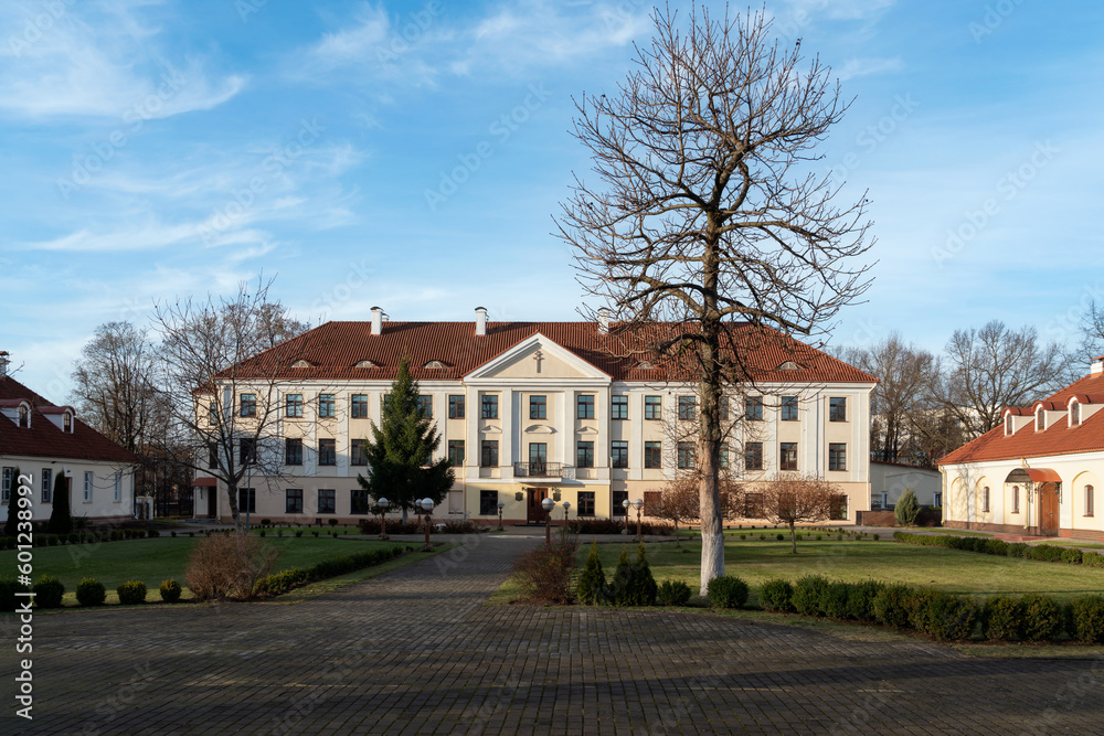 Building of the Valitsky Palace (Dzekonsky Palace, Vice-administrator's Palace, Administrator's Palace) — an architectural monument surrounded by a park, on a sunny day, Grodno, Belarus