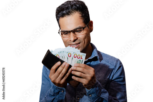hombre joven latino en fondo blanco con billetes en las manos, expresión de codicia y feliz, oliendo el dinero, y sacándolo de la billetera. photo