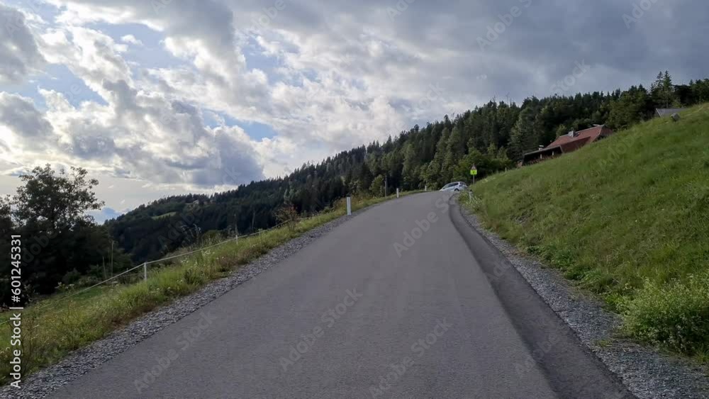 With the car on a road between mountains With the car on a road between mountains