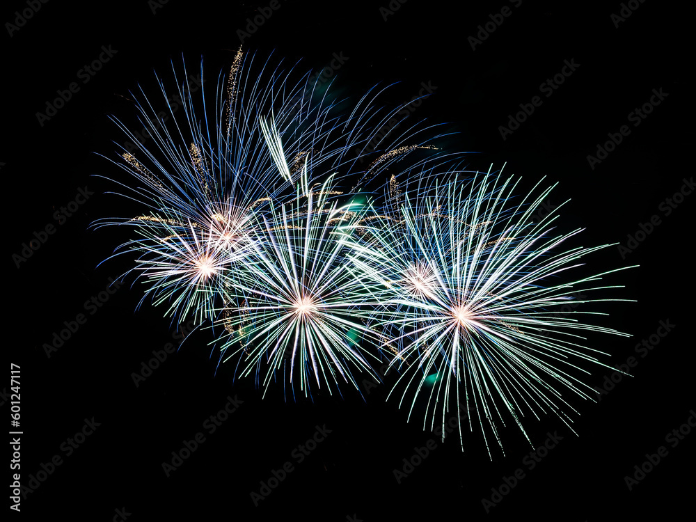 Multiple fireworks against the deep black sky. Bright display of the fireworks Multiple fireworks against the deep black sky. Bright display of the fireworks