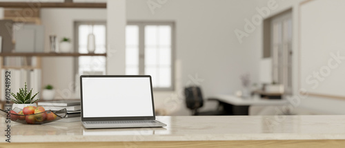 Minimal white home workspace with laptop mockup, apple tray, books, and copy space.