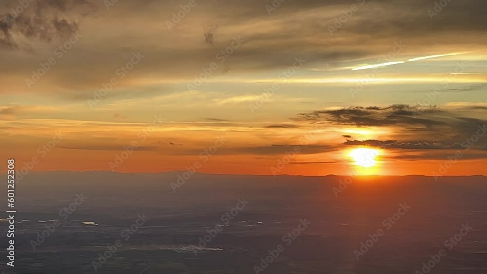 Stunning colorful sunset from above: a pilot’s perspective while flying westbound approaching to Madrid airport, Spain. 8000m high. Stunning colorful sunset from above: a pilot’s perspective while flying westbound approaching to Madrid airport, Spain. 8000m high.