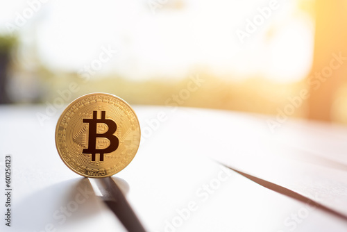 Bitcoin Cryptocurrency trade and investment concept. Gold Bitcoin Cryptocurrency on table with blurred background, copy space. Trader, investor trading and investing on Bitcoin Cryptocurrency concept.