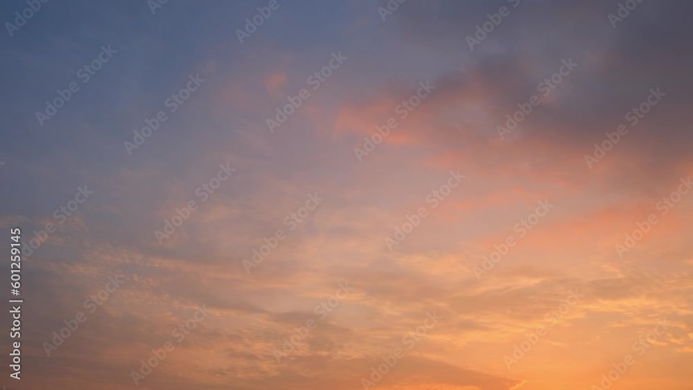 Time-lapse video of the sunset captures the mesmerizing transformation of the sky. Watch as the sunsets and the sky changes from blue to warm hues of orange, red and yellow. Nature concept. 4K
