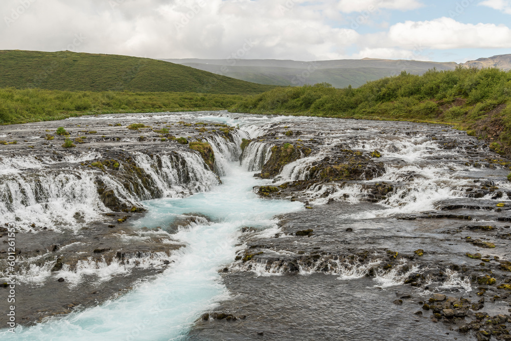 Summer view on Bruarfoss waterfall in the south of Iceland. Hike, trail, hiking, powerful, clear, pure, unpolluted, magical, wonderful, icelandic rivers, long exposure
