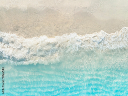 Fototapeta Naklejka Na Ścianę i Meble -  Aerial view with beach in wave of turquoise sea water shot, Top view of beautiful white sand background