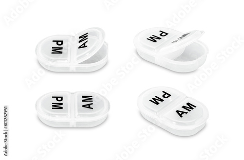 Empty daily pillbox for medications and nutritional supplements isolated on a white background.