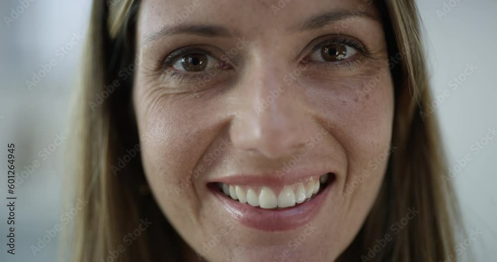 Face, portrait of woman smiling and in blurred background. Happy or good news, closeup happiness or positivity facial expression and headshot of female person with a big smile indoors at her home