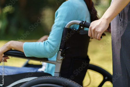 Depressed sad asian woman in wheelchair lonely disabled adult