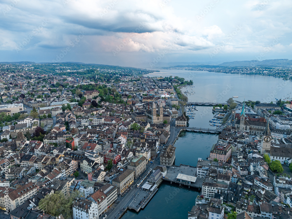 Aerial view over Swiss City of Zürich with Limmat River, old town and Lake Zurich on a beautiful spring evening with colorful dramatic sky. Photo taken May 6th, 2023, Zurich, Switzerland.