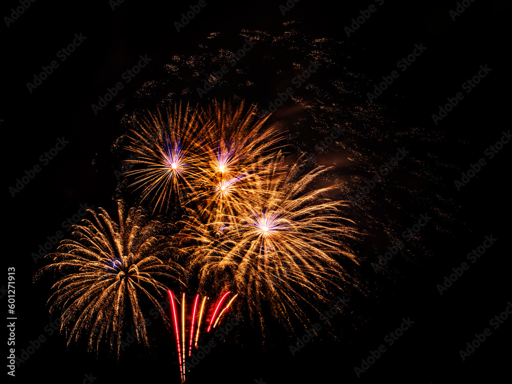 Multiple fireworks against the deep black sky. Bright display of the fireworks Multiple fireworks against the deep black sky. Bright display of the fireworks