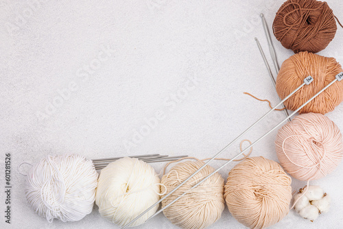 A set of pastel natural colors clews of thread for knitting and craft tools. Handmade, hobby concept