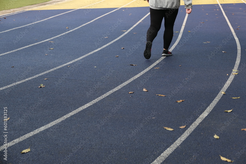 the running track is crossed by the runners in the morning the running track is crossed by the runners in the morning