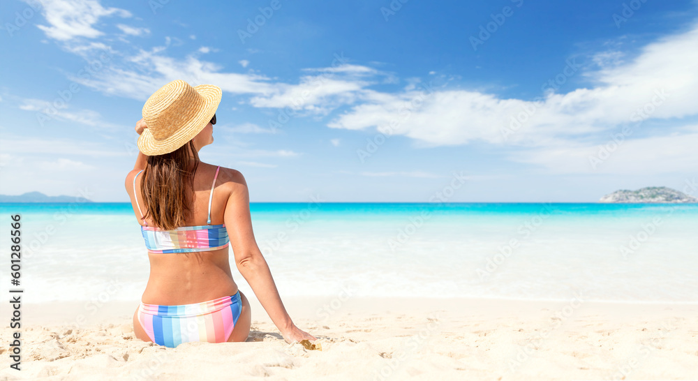 Woman in bikini on the tropical sea beach Woman in bikini on the tropical sea beach