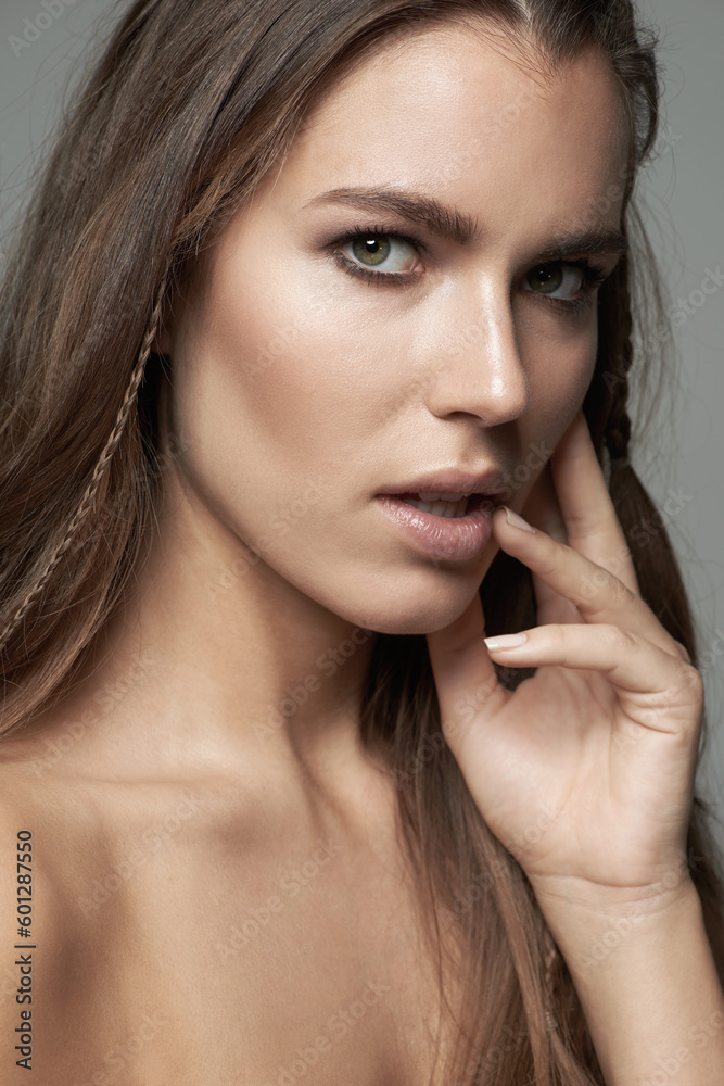 Sensual, beauty and portrait of woman in studio for wellness, facial treatment and self care. Seductive, skincare and female person with natural cosmetics, makeup and satisfaction on gray background