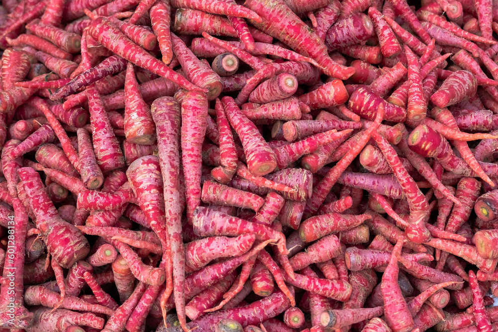 Red carrot background, food concept