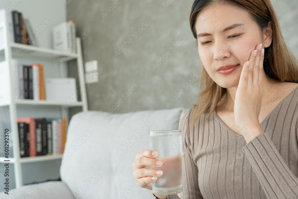 Asian woman feel sensitive teeth after drinking cold, female suffer tooth, decay problems, dental care, tooth extraction, decay problem, bad breath, Gingival Recession, Oral Hygiene instruction Asian woman feel sensitive teeth after drinking cold, female suffer tooth, decay problems, dental care, tooth extraction, decay problem, bad breath, Gingival Recession, Oral Hygiene instruction