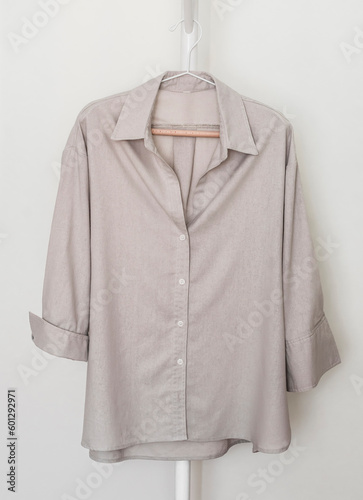 Cotton women's casual oversized  shirt on a hanger