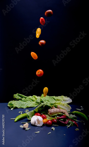 Vegetables composition with "flying" tomatoes