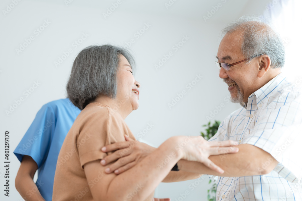 Asian senior couple in love laughing, Happy adult mature classy couple hugging and bonding, Carefree cheerful mid age old husband embracing wife looking away dreaming at home, health insurance concept Asian senior couple in love laughing, Happy adult mature classy couple hugging and bonding, Carefree cheerful mid age old husband embracing wife looking away dreaming at home, health insurance concept