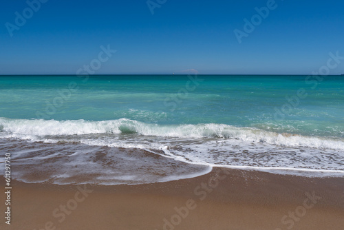 Sea surf on the beach of Spain in spring. High quality photo