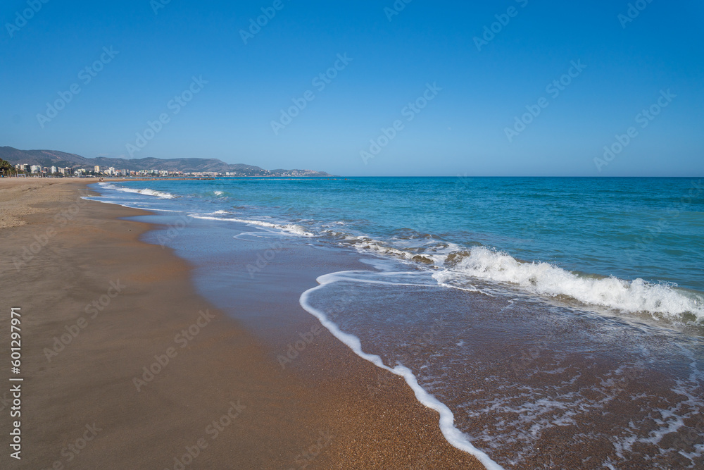 Sea surf on the beach of Spain in spring. High quality photo