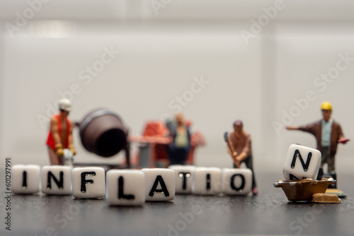 high inflation concept, increase of price levels of goods and services recent months in the economy with little figurine workers composition on black and white backgound
